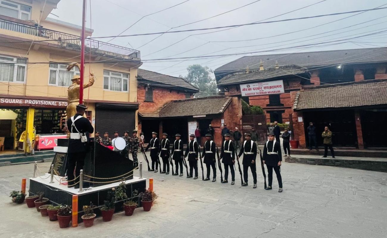 Historic Gorkha Durbar with traditional Nepali army guards standing in ceremonial uniform