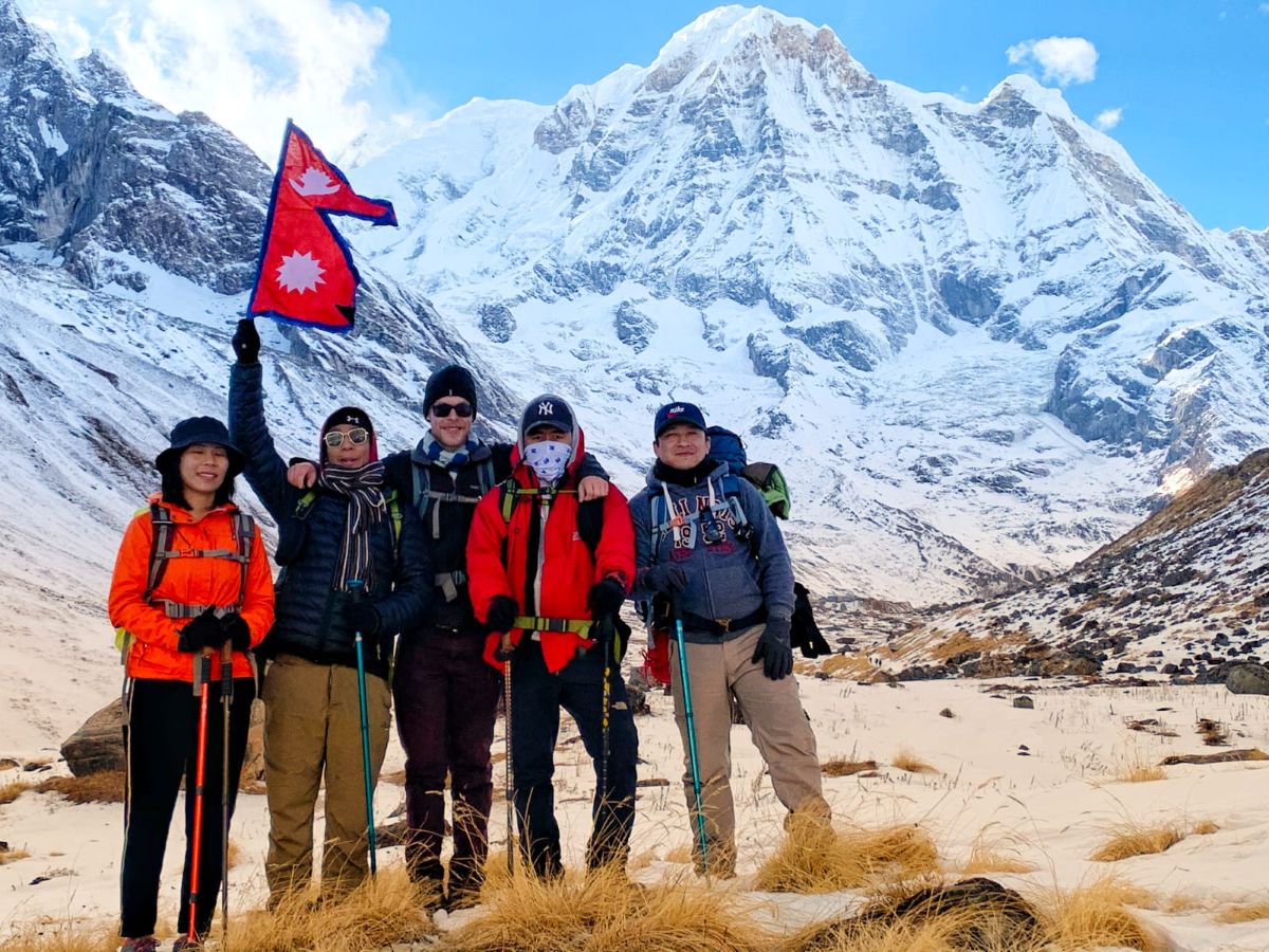travelers enjoying the mountain views at annapurna base camp
