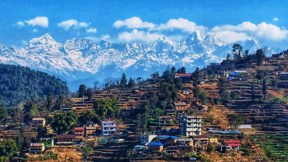 Nagarkot village with terraced fields and Himalayan mountain view in Nepal